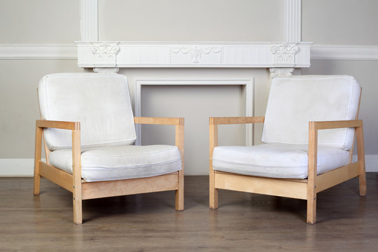 white chairs and beautiful ornate decorative plaster molding