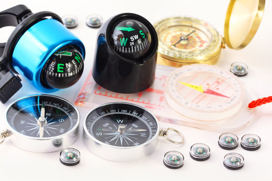 Fifteen different multi-colored compasses - Powered by Adobe