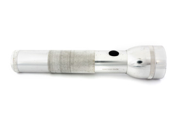 Silver flashlight over white