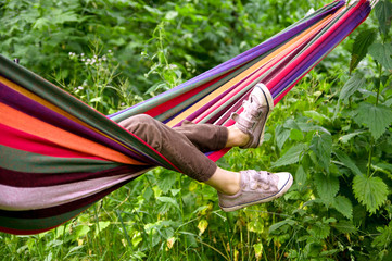 child lying in a hammock