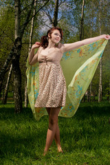 Portrait of young female smiling in a forest- Outdoor