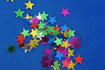 Glittering stars on blue background
