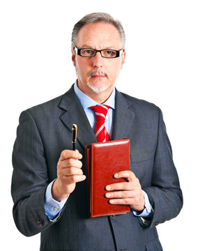 Senior businessman holding some documents and a pen