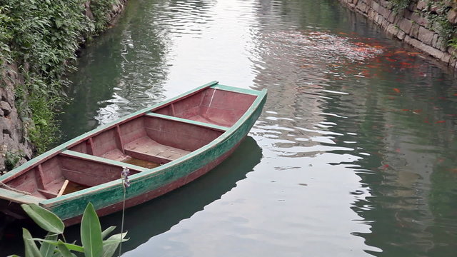 Small fishing boat floating on the water