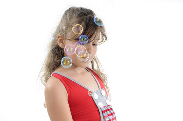 girl playing with soap bubbles