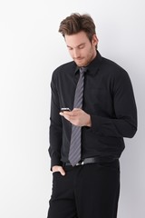 Young businessman using mobile phone