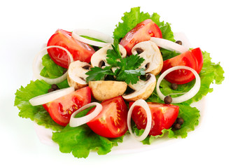 many vegetables on the plate isolated on white