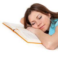 Beautiful student is sleeping on the book