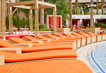 Orange Chaise Lounges at a Resort Patio