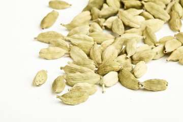 Green Cardamom Pods on white background