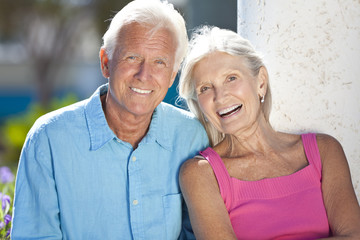 Happy Senior Couple Smiling Outside in Sunshine