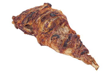Closeup of roasted whole lamb leg with garlic isolated on white