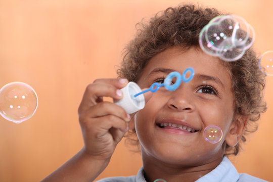 Boy Blowing Bubbles