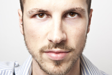 Obraz premium young man's face, intense look