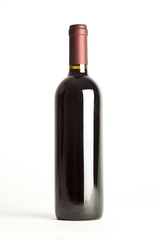 red wine bottle isolated against white background