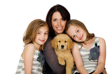 a pretty mom, her kids and a puppy