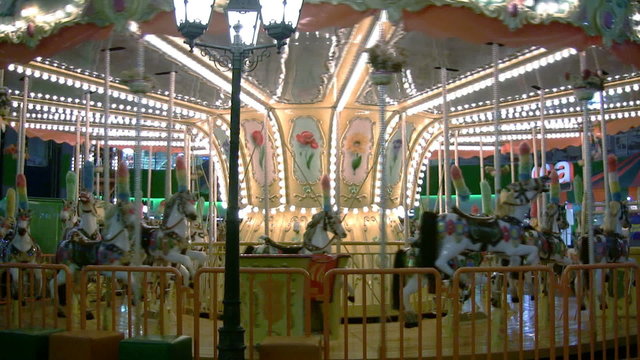 Traditional carousel - pony and horse ride, merry-go-round