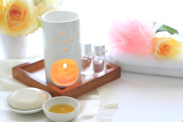 Aroma oil and candle with towel