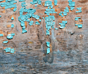 old blue flaky paint on a plywood background