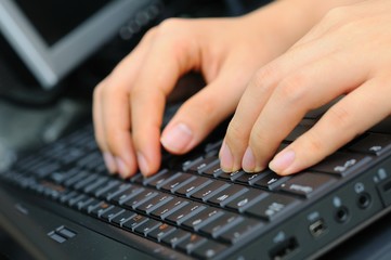 Both hands on keyboard