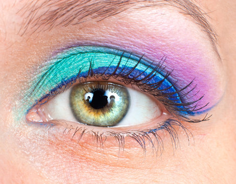 Eye with pink and green make-up