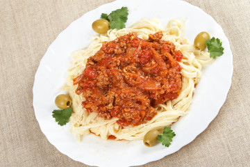Italian cuisine. Pasta with meat sauce