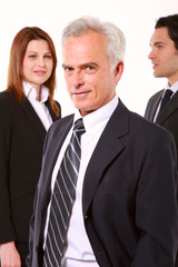 two businessman and one businesswoman