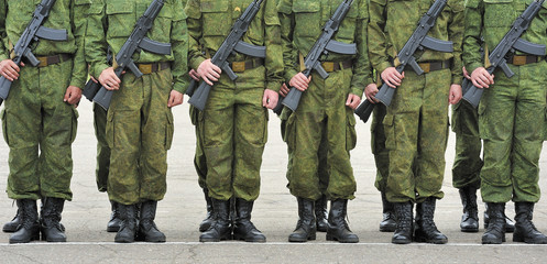 formation of soldiers with guns