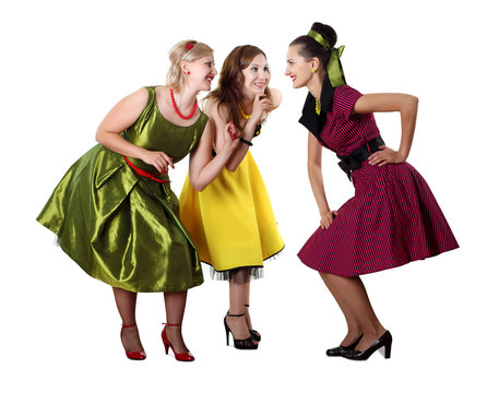 three young woman in bright colour dresses