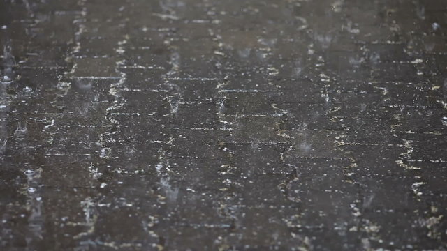 Raindrops on pavement