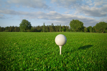 Golf ball on the tee - idyllic golf course of Adare