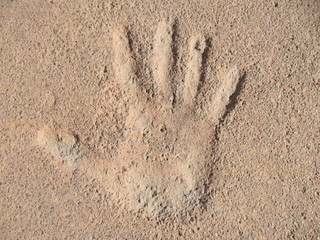 Hand print on cement.
