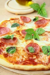 Fotobehang Fresh hot pepperoni pizza - closeup © Olga Kriger