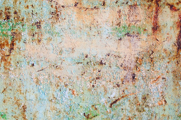 Peeling paint on rusty iron or metal background
