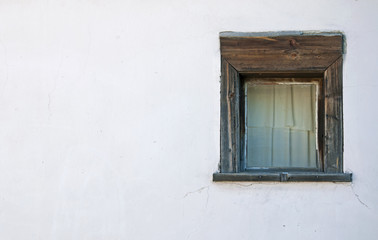 Old windows on the white wall