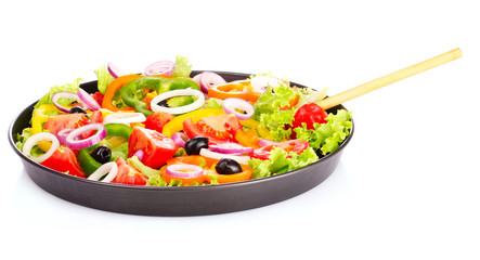 many vegetables in a bowl isolated on white