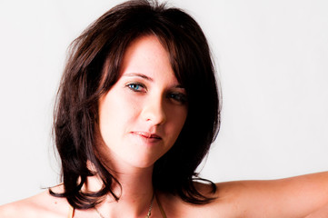 Naklejka premium Beautiful brunette blue eyed sexy model smiling