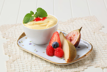 Bowl of creamy pudding and fresh fruit