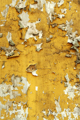 Old wall with cracked peeling paint