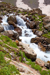 Naklejka na ściany i meble Scenic view of caucasus mountains. waterfall