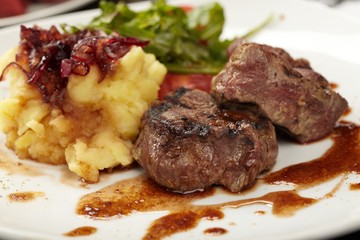 Beef steaks with vegetables