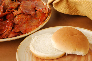 Bun by a plate of barbeque beef