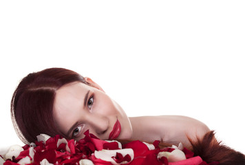 Obraz na płótnie Canvas Beautiful woman and roses petals on white background