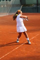 girl playing tennis