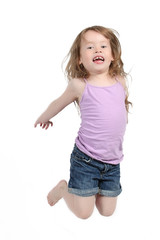 Little girl jumps on a white background