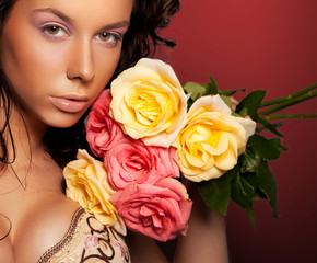 Beautiful young lady with roses