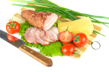 Arrangement with meat smoked bacon, tomatoes and cheese