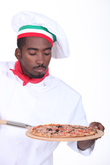 Pizza chef with an oven board