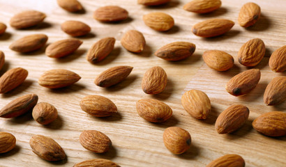 Almonds on wooden background