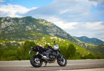 Obraz premium Modern motorbike on the road border